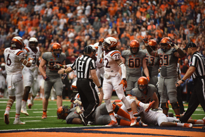 Syracuse offensive lineman Aaron Roberts signals for a touchdown in last season's 31-17 upset of then-No. 17 Virginia Tech.