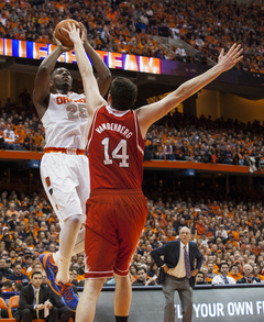 Rakeem Christmas rises over Wolfpack center Jordan Vandenberg. Christmas led the Orange with 14 points and added  12 rebounds. 