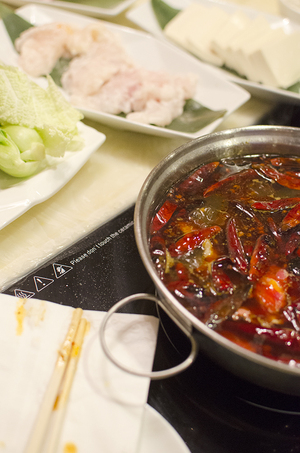 Diners can opt to cook their own food at the hot pots located at their tables. 