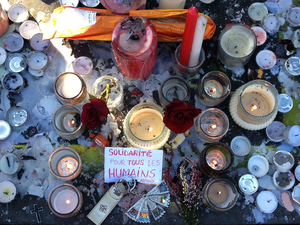 A memorial honors the victims of the Paris attacks on Friday, where at least 132 people were killed. 