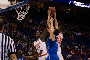 Tyler Lydon rises up for a loose ball against Middle Tennessee State on Sunday night in the Round of 32. He had 14 points and seven rebounds in the win.