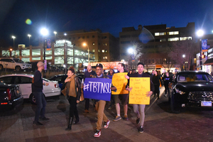 Syracuse University students march down Marshall Street as part of the Take Back the Night event on Wednesday night.