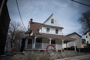 Greek letters have been removed from Theta Tau’s house on Harrison Street.