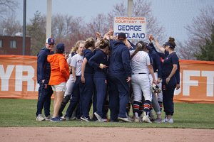 Syracuse huddles together.