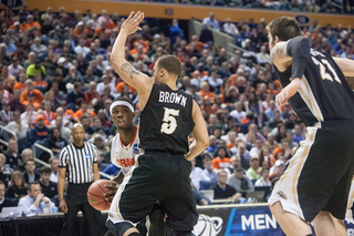 Fair looks for his shot as Western Michigan guard David Brown defends.