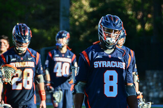 Lecky dejectedly walks off the field after the Orange's comeback fell just short.