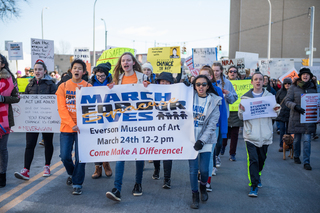 Hundreds of rally attendees marched by Syracuse City Hall on Saturday. 