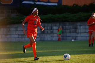 Junior Clarke Brown looks to pass the ball to a teammate during the match against Siena.