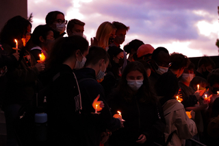 Vigil attendees gather on the steps of Hendricks Chapel.